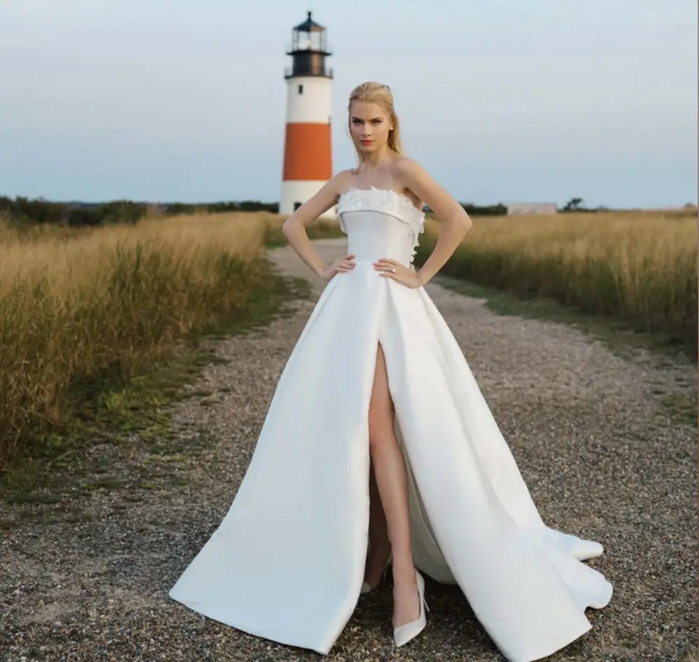 Model wearing a white laced bridal gown