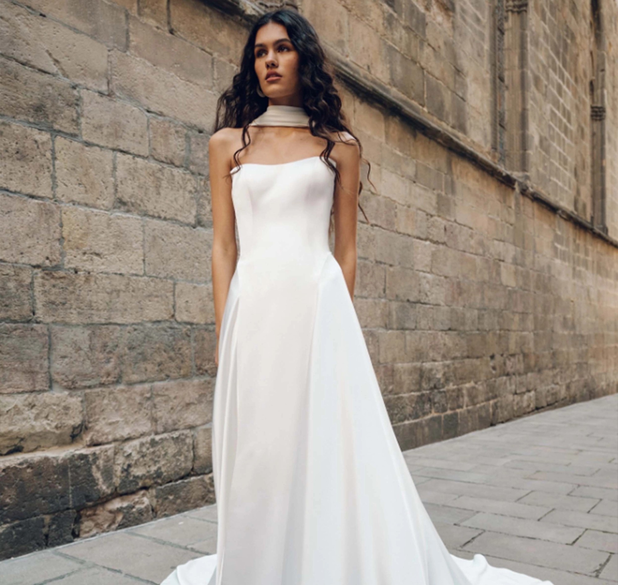 Model wearing a white laced bridal gown