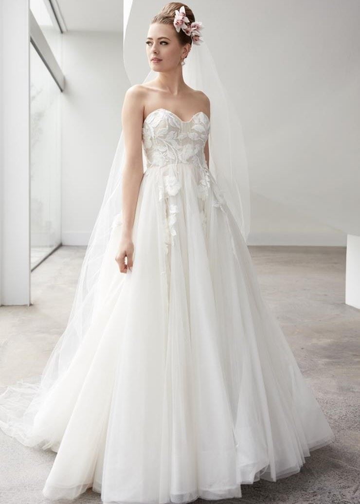 Bride wearing strapless lace wedding dress