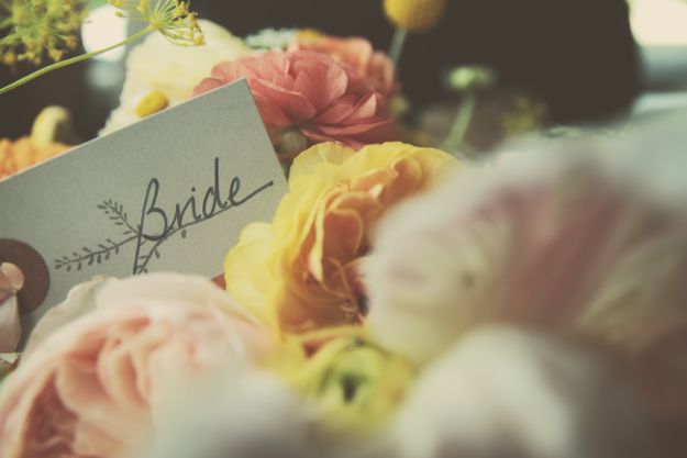 bride tag bouquet close up