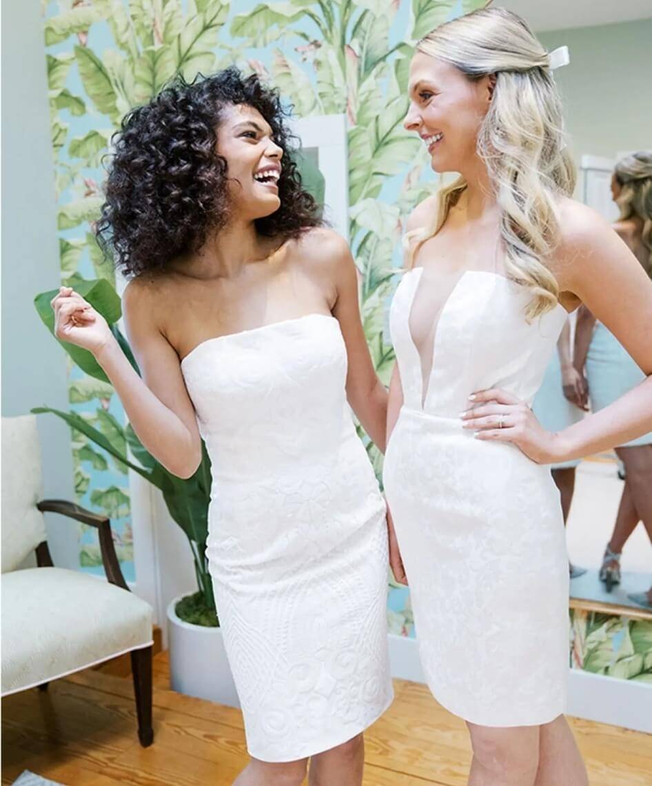 Models wearing a white gowns