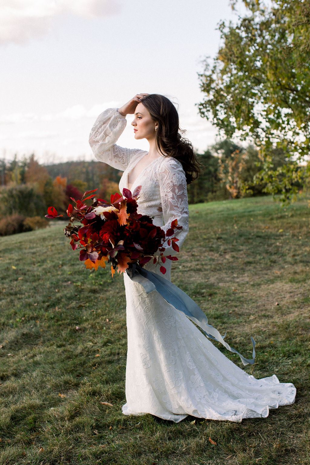 Bride wearing vintage-inspired long sleeve wedding dress